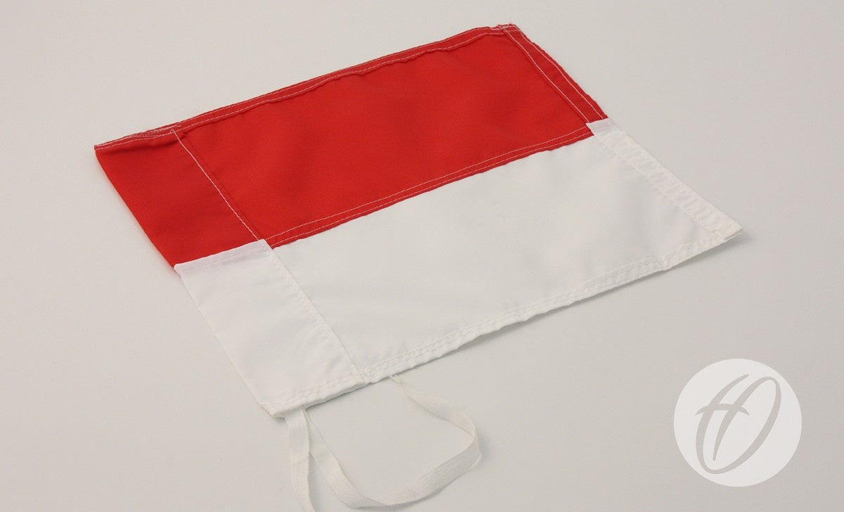 The Harrod Sport Red & White Horizontal Flag measures 30cm x 30cm, featuring red and white horizontal stripes. It includes PVC corner poles and white ties along the edge, displayed flat on a white background.