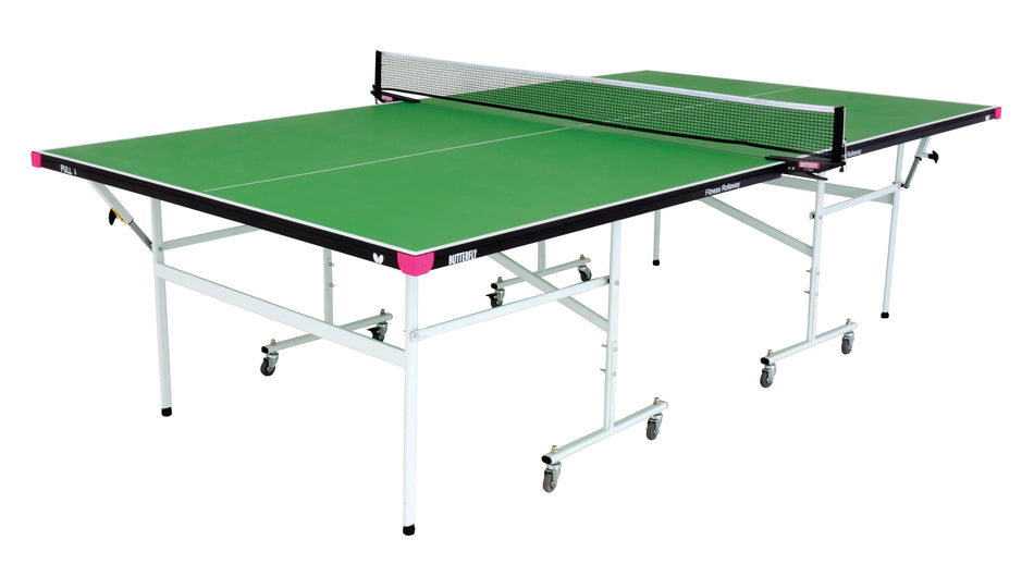 The Butterfly Fitness Indoor Table Tennis Table by Butterfly features a green surface with white lines, a white net, and foldable metal legs on wheels; shown isolated on a white background.