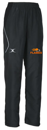 The Flames Netball Club Gilbert Blaze Track Trouser by Gilbert features black fabric, white detailing, an embroidered white logo on the left thigh, and an orange FLAMES logo with flame graphic—ideal for club fans or athletic wear.