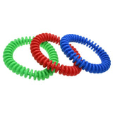 The Reydon Sports Flexi Throwing Ring set features three interlocking, ribbed rings in green, red, and blue. Made from flexible, durable material, they're ideal for throwing and catching. Displayed on a white background.