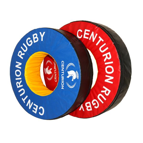 Two large Centurion Foam Tackle Rings (Doughnut), one blue and one red with white centurion helmet logos, overlap at an angle on a white background—ideal rugby tackling practice equipment.