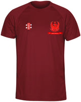 The Gray Nicolls Forest Exiles CC Matrix V2 T Shirt is a maroon short-sleeve training tee with a red eagle-and-ribbon emblem on the left chest, a small logo on the right, and moisture-wicking fabric for active workouts.