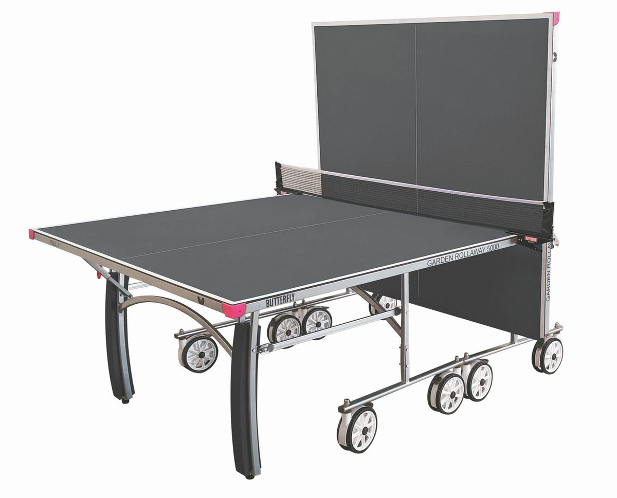 The Butterfly Garden Rollaway 5000 Outdoor Table Tennis Table (Grey) features a melamine top, metal legs, large wheels, and a net. It can be half folded upright for solo play.