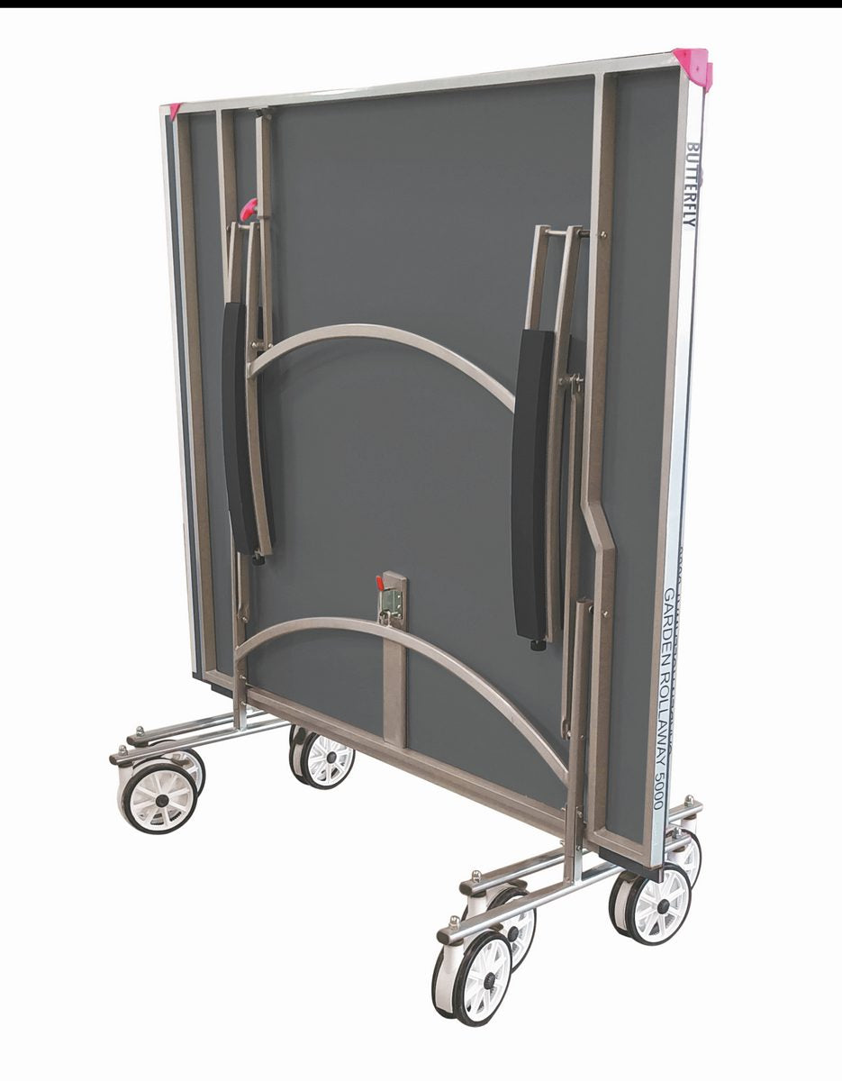 The Butterfly Garden Rollaway 5000 Outdoor Table Tennis Table (Grey) by Butterfly features a melamine top, metal frame, black cushioned handles, and four sets of double wheels for easy upright storage and mobility.