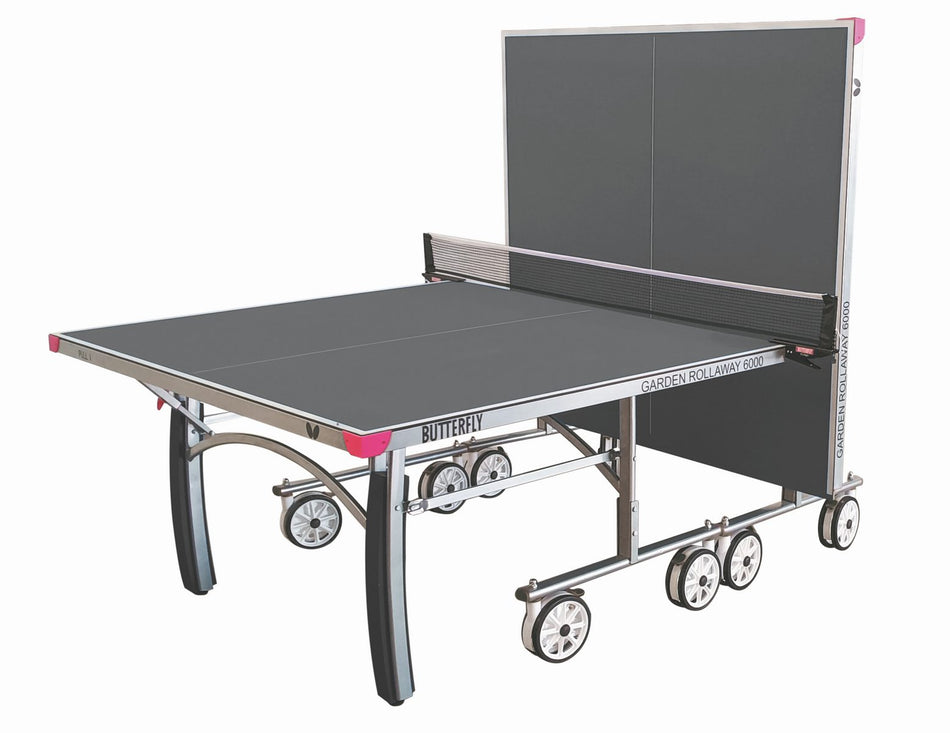 The Butterfly Garden Rollaway 6000 Outdoor Table Tennis Table (Grey) features a 6mm melamine top, wheels, and a net. Shown partially folded with one half upright for solo play. Brand: Butterfly.