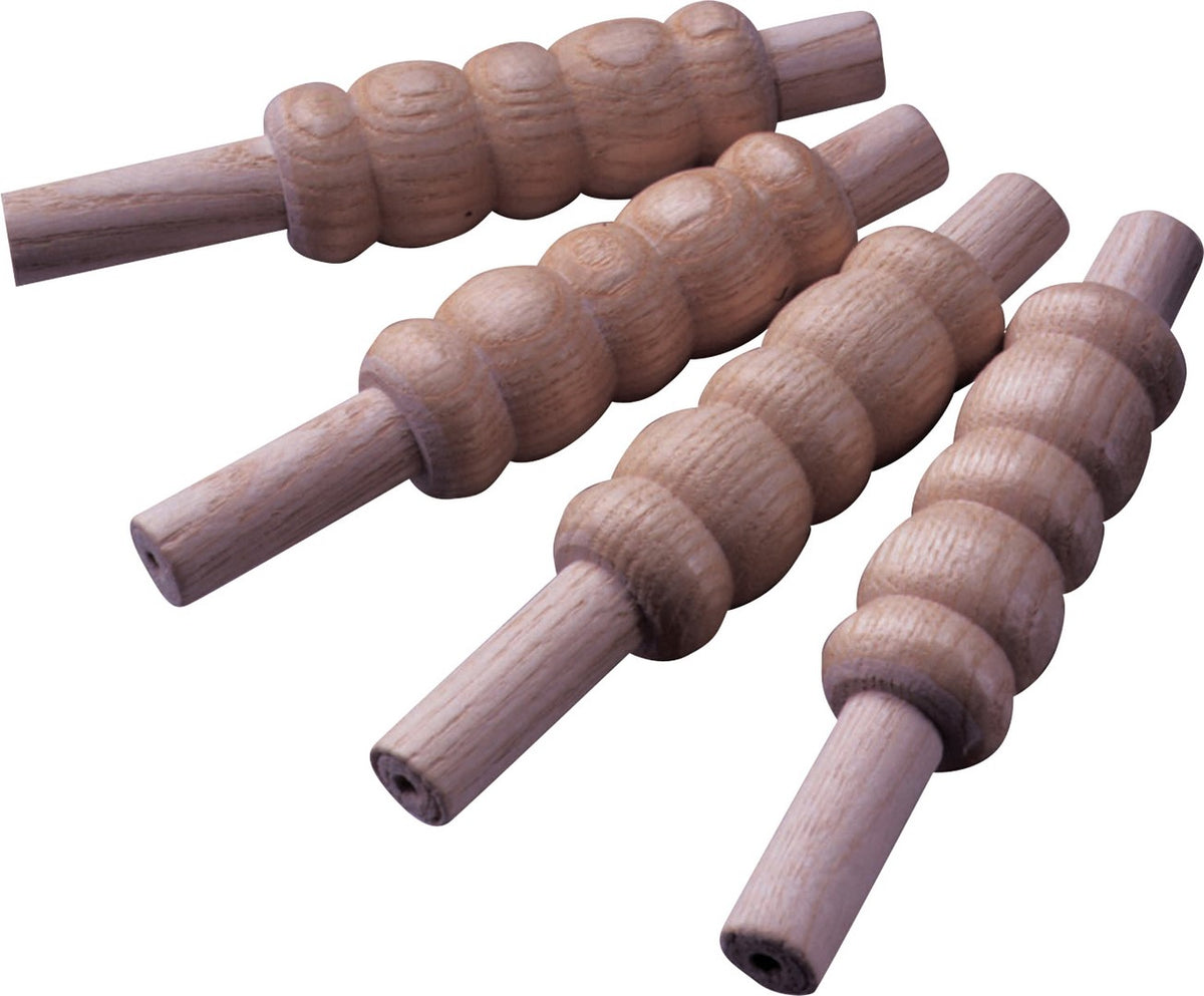 The Kookaburra Heavy Bails Senior by Kookaburra are four dark wooden rollers with varied textured, grooved surfaces. Each features cylindrical handles on both ends for a comfortable grip, and they're arranged on a white background.