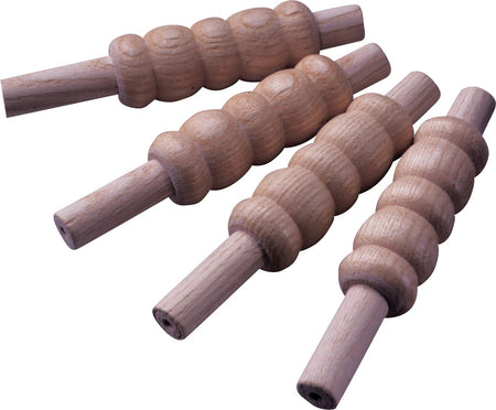 The Kookaburra Heavy Bails Senior by Kookaburra are four dark wooden rollers with varied textured, grooved surfaces. Each features cylindrical handles on both ends for a comfortable grip, and they're arranged on a white background.