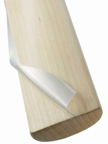 A close-up of a Kookaburra Clear Anti Scuff Facing partially peeled from a cricket bat blade, revealing the smooth wood beneath. Brand: Kookaburra.