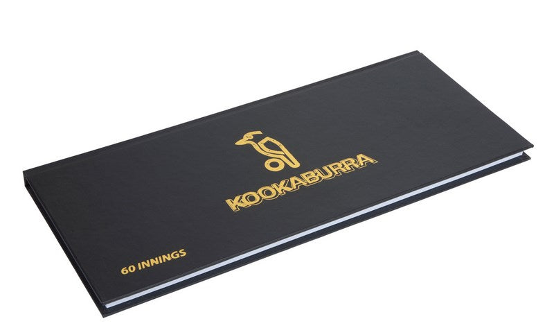 The Kookaburra 60 Innings Scorebook, a black hardback by Kookaburra with gold text and logo on the cover, is pictured closed and viewed at an angle.