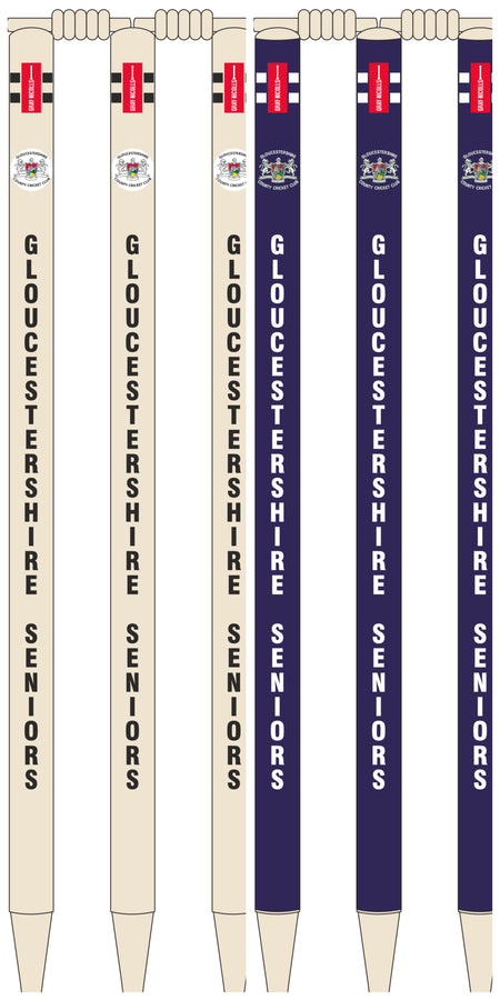 Four cream and four navy vertical pens, each with a red top and Gloucestershire Seniors crest, are custom printed by Gray Nicolls to resemble club cricket stumps, featuring "GLOUCESTERSHIRE SENIORS" printed down the side.