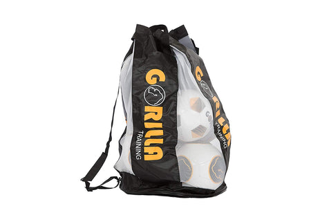 The Gorilla Training Ten Ball Sack by Gorilla Training is a black mesh bag with "GORILLA" in yellow letters, adjustable straps, and a partially transparent design showing white and orange soccer balls inside.