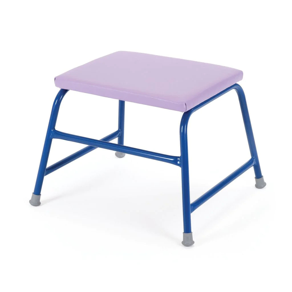 The Niels Larsen Agility Table by Niels Larsen features a purple rectangular cushioned seat and blue metal legs with gray rubber feet, all set against a white background.