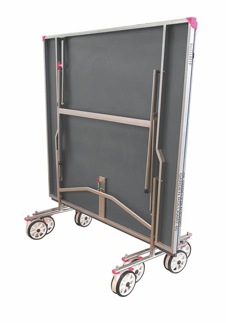 The Butterfly Garden Rollaway 40 Table Tennis Table (Grey) by Butterfly features a foldable metal frame, gray anti-glare melamine surface, pink corner accents, and wheels for easy storage and mobility in an upright position.