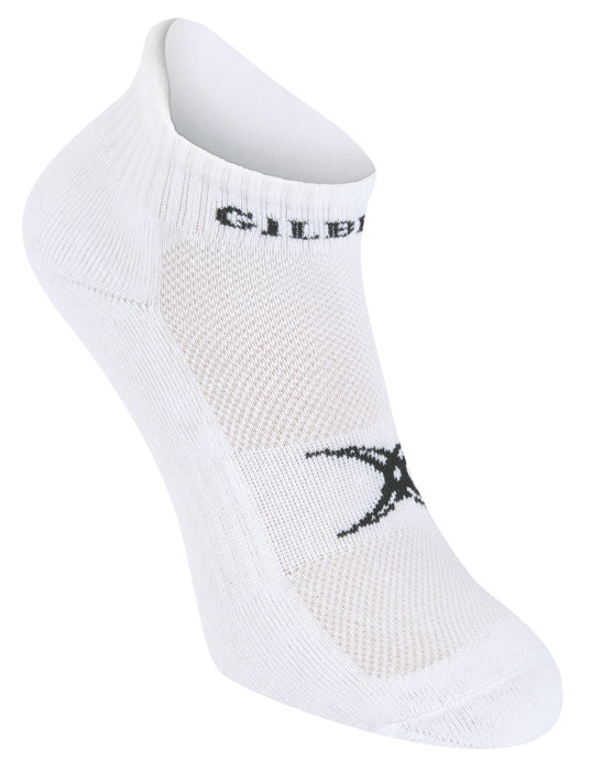 The Gilbert Netball Ankle Sock by Gilbert is a white ankle sock with a black logo on top, ribbed cuff, and elastic mid foot support, shown against a plain white background.