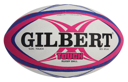 The Gilbert Touch Rugby Ball is a white ball with blue and pink curved stripes, featuring "GILBERT" in bold black letters and "TOUCH RUGBY BALL" in pink and black—ideal for training.