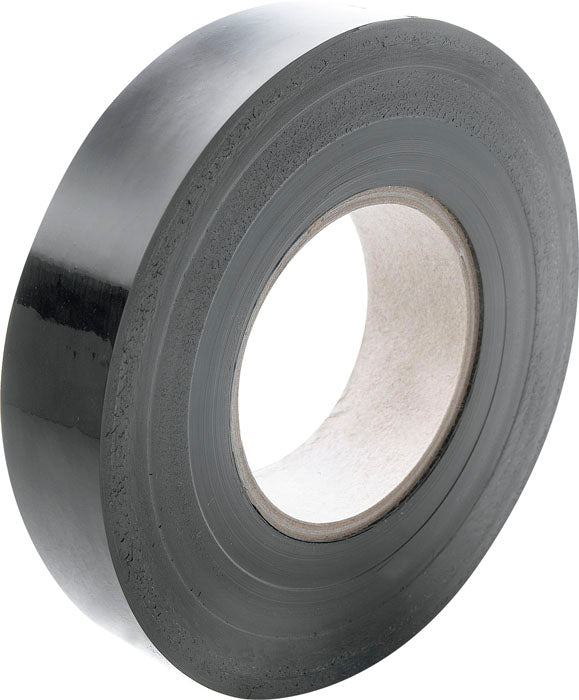 A roll of Gilbert Wondertape by Gilbert, black electrical tape with a cardboard core, is shown at an angle on a plain white background.