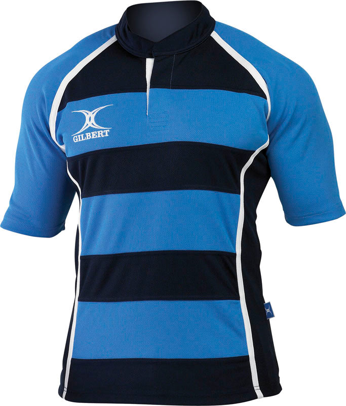 The Gilbert Xact Match Hoop Shirt by Gilbert features sky/navy hoops with white piping, a standard rugby collar, buttoned neckline, and a small white Gilbert logo on the left chest. Lightweight and breathable, it's ideal for intense rugby play.