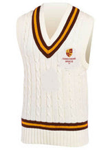 The Gloucestershire Gipsies Cricket Slipover by Martin Berrill Sports is a sleeveless white cable-knit vest with brown and yellow stripes on the V-neck and hem, and features embroidered club and Gloucestershire Gipsies CC crests on the chest.