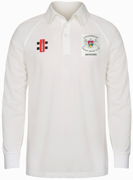 The Gray Nicolls Gloucestershire CCC Seniors Long Sleeve Matrix Shirt is a white, moisture-wicking cricket top with a collar and two embroidered chest logos: a rectangular badge and the Gloucestershire CCC Seniors crest.