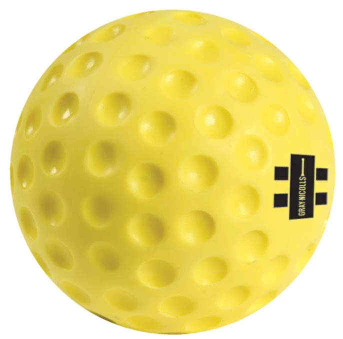 The Gray Nicolls Bowling Machine Ball is a bright yellow PVC ball with evenly spaced dimples and a small black rectangular Gray Nicolls logo, perfect for use with bowling machines.