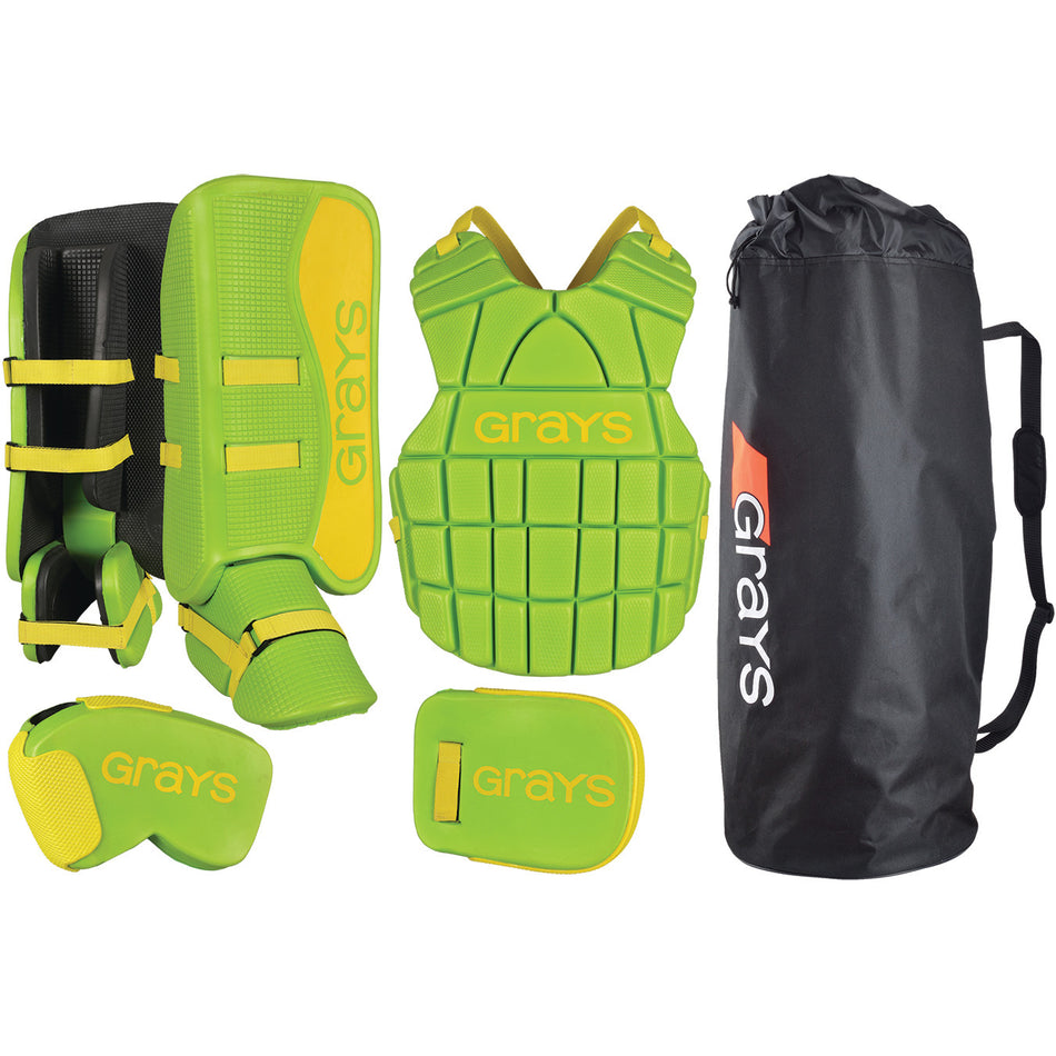 The Grays G90 Junior Goalie Set features lime/yellow leg guards, chest protector, gloves, and a black Grays bag—all shown on a white background. Perfect for young goalies.