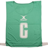The green Gilbert Netball Bibs by Gilbert are made from breathable polyester, feature a large white “C” for center position with the brand name above, and are ideal for netball bib sets.