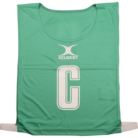 The green Gilbert Netball Bibs by Gilbert are made from breathable polyester, feature a large white “C” for center position with the brand name above, and are ideal for netball bib sets.