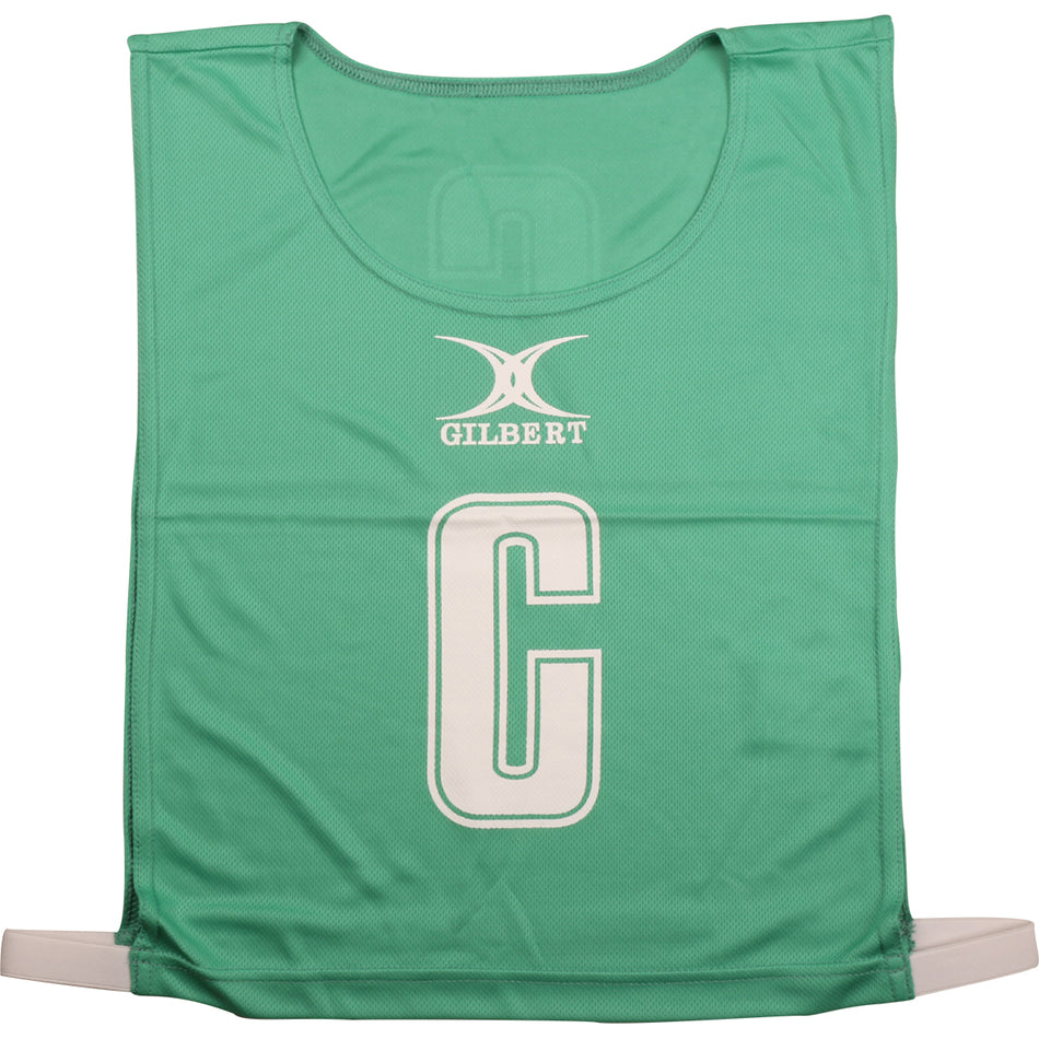 The green Gilbert Netball Bibs by Gilbert are made from breathable polyester, feature a large white “C” for center position with the brand name above, and are ideal for netball bib sets.