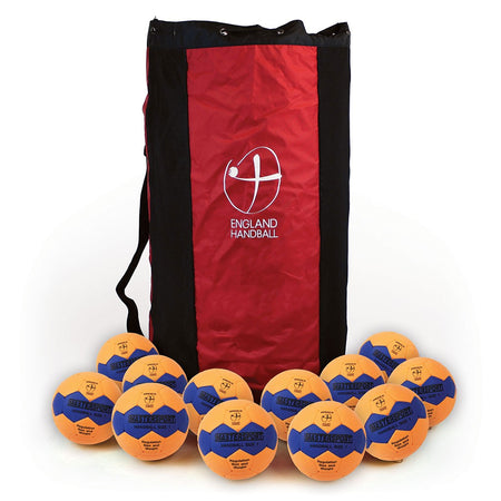 A red and black England Handball bag with a white logo stands upright, surrounded by twelve yellow and blue Mastersport Handballs, EHA approved and made with high-quality cellular rubber construction. The balls are branded Mastersport.
