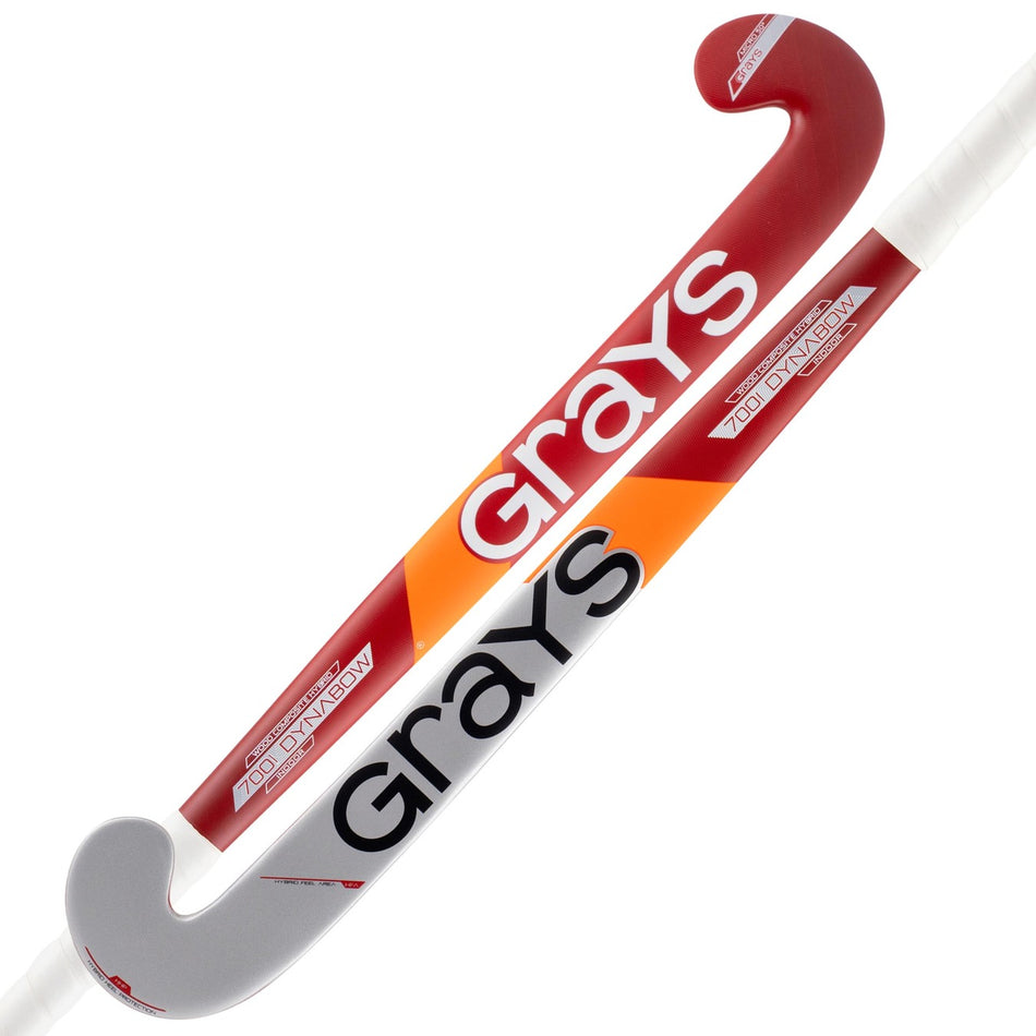 Two Grays 700i Dynabow Indoor Wooden Hockey Sticks with aramid fiberglass reinforcement for durability. Each stick features a bold shaft, white handle, curved red tip, and accents in red, white, and orange.