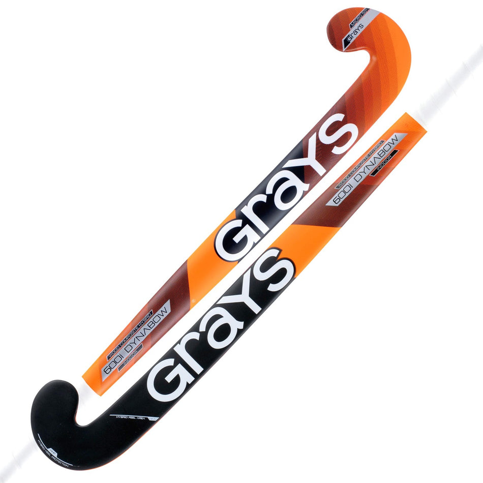 Two Grays 600i Dynabow Indoor Wooden Hockey Sticks feature orange, black, and white designs, the Grays logo, the model name 600i Dynabow on the shaft, and a dynabow blade profile for improved performance.