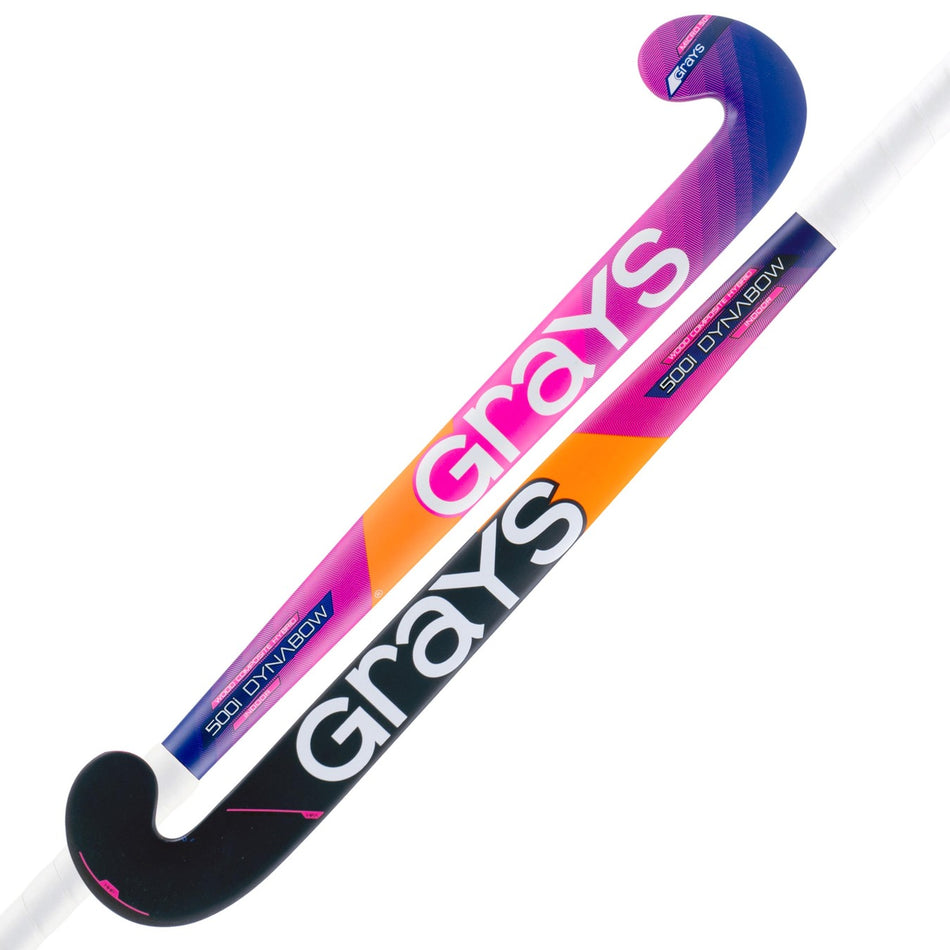 Two Grays 500i Dynabow Indoor Wooden Hockey Sticks feature a curved dynabow blade profile, distinct black, purple, orange, and pink color scheme, plus prominent GRAYS branding on the shaft.