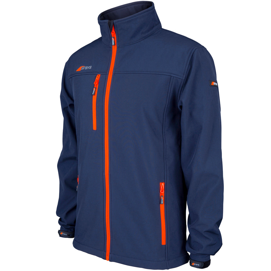 The Grays Radius Junior Soft Shell Jacket by Grays features bright orange zippers, zippered chest, side and sleeve pockets, a high collar, and water-resistant protection for all-weather comfort in stylish navy blue.
