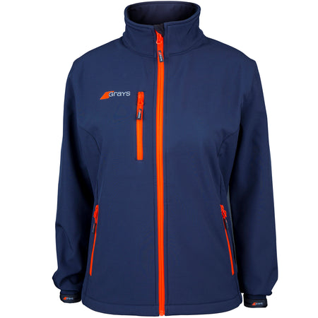 The Grays Ladies Radius Soft Shell Jacket in navy features bright orange zippers, a high collar, two front zip pockets, a small Grays logo on the left chest, and breathable water-resistant fabric for comfort in changing weather.