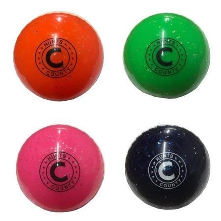 The Hunts County Glitter Ball set includes four soft PVC training balls in orange, green, pink, and dark blue. Each features the Hunts County logo in black and white on the front and is displayed against a clean white background.