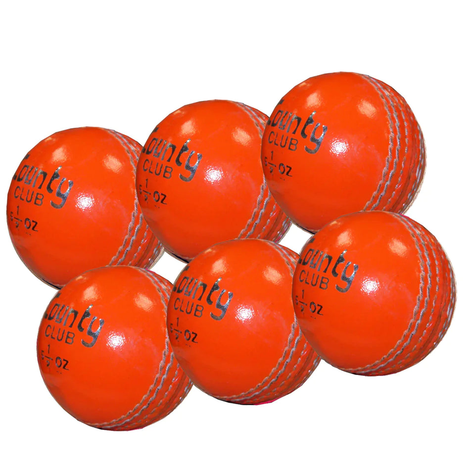 Six orange Hunts County Club cricket balls with white stitching, arranged in two rows. Each training ball features "county CLUB" and "5 1/2 OZ" printed in black. Brand: Hunts County.