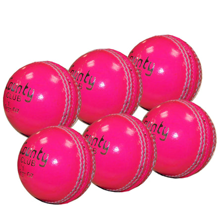 Six Hunts County Club Ball Six Pack training balls in bright pink with white stitching, arranged in two rows on a white background. Each ball features the Hunts County brand printed in black.