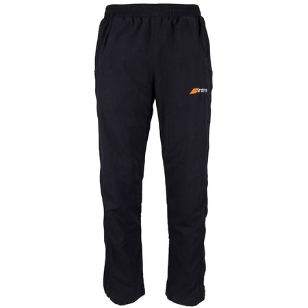 Grays Junior Glide Trousers in black feature an elastic waistband, side pockets, a small orange and white Grays logo on the left thigh, and a long leg zipper for easy wear. Shown against a plain white background.