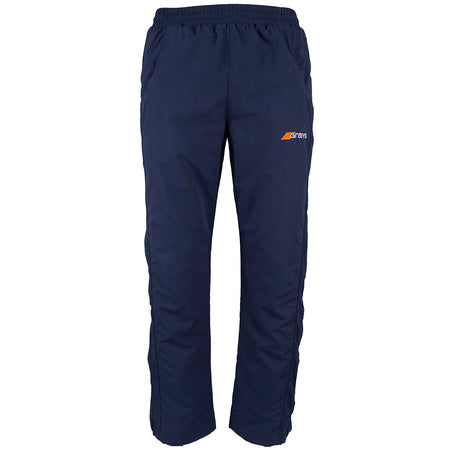 Grays Junior Glide Trousers in navy blue with an elastic waistband, side pockets, long leg zipper, and a small orange and white trans logo on the left thigh.