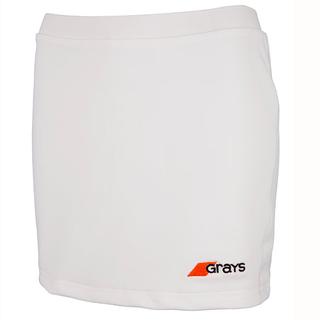 The Grays Apex Hockey Skort is a plain white women's athletic skort with an elastic waistband and a small orange and black Grays logo on the bottom right front.