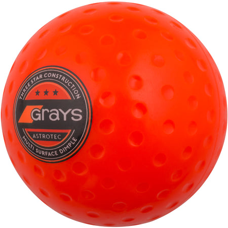 The Grays Astrotec Hockey Ball is a bright orange field hockey ball with the Grays logo, ideal for club match play at county level.