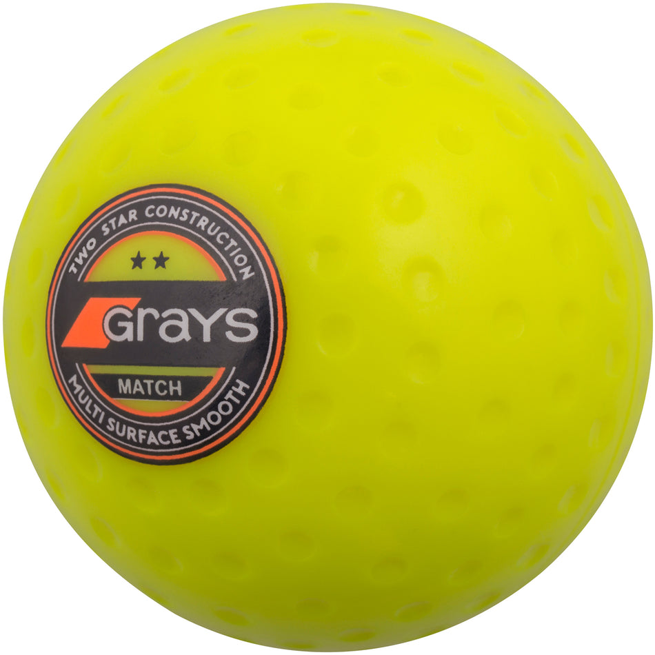 The Grays Match Hockey Ball is a bright yellow dimpled ball with a "Grays Match" circular label—perfect as a club level hockey ball.