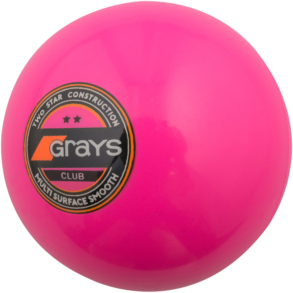 The Grays Club Hockey Ball is a bright pink ball labeled “Grays Club,” designed for club play or training on synthetic pitches, and features two star construction for multi-surface use.