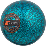 A blue Grays Glitter Xtra Hockey Ball featuring a shiny, textured finish and labeled with "Grays, Three Star Construction, Glitter Xtra, Multi Surface Smooth"—ideal for use under floodlights.