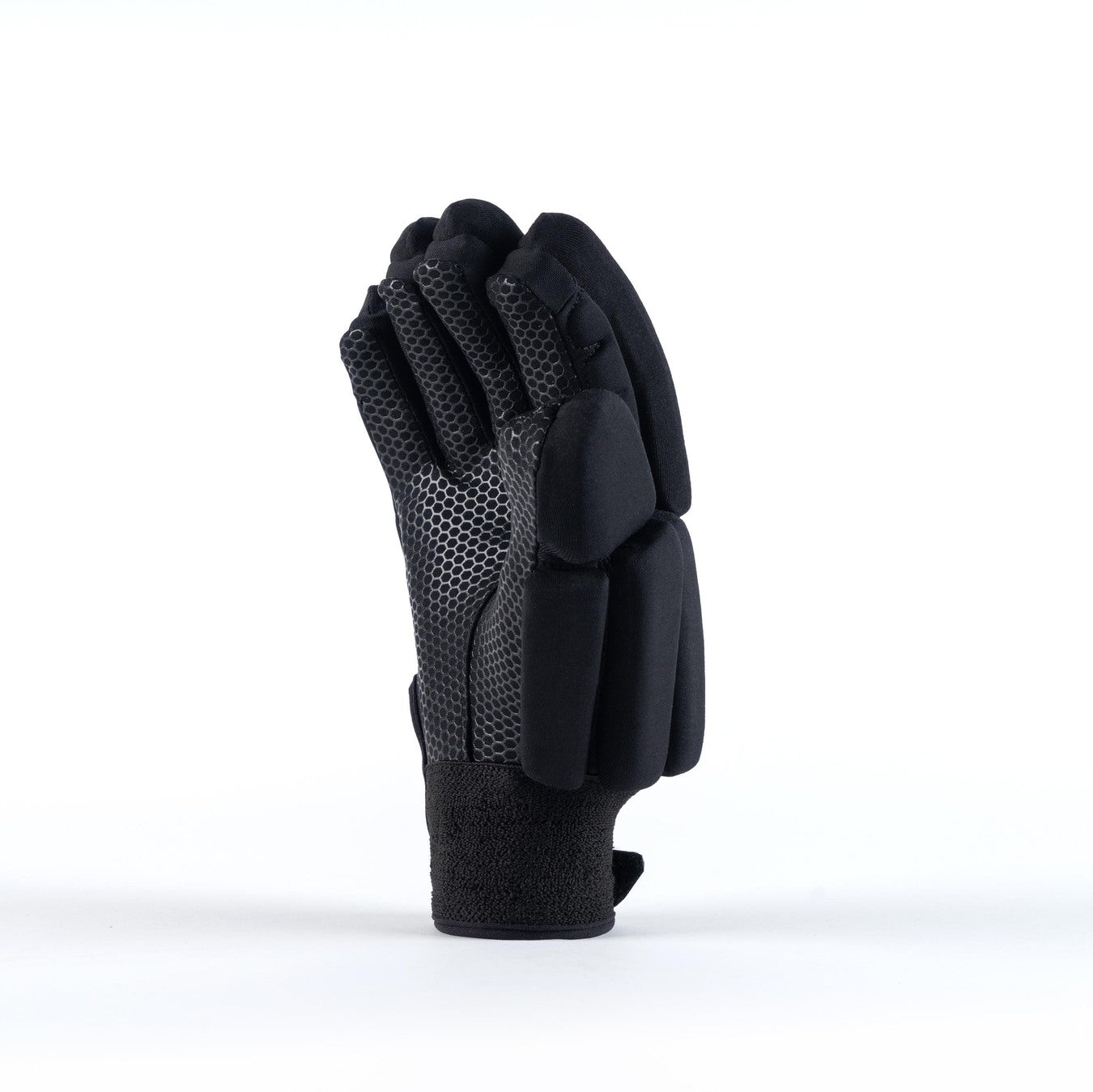 The Grays Proflex 1000 Hockey Glove by Grays features black and gray padding, curled fingers, and textured material on the palm and fingers for enhanced knuckle protection, shown upright on a white background.