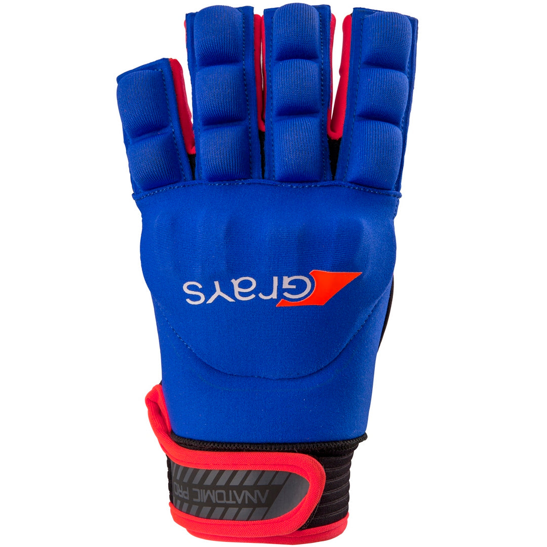The Grays Anatomic Pro Hockey Glove is blue with moulded knuckle armour, red trim, and a black wrist strap, displaying the Grays logo and name in white and orange on the back of the hand.