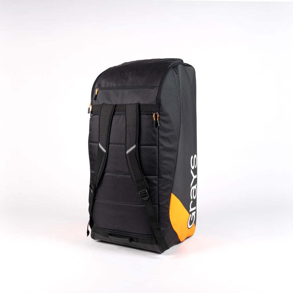 The Grays GK500 Goalie Duffle is a large black, water-resistant sports bag with padded shoulder straps, orange accents, and "Grays" in white on the side, shown standing upright against a plain white background.