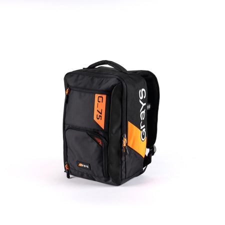 The Grays G75 Rucksack is a black and orange junior hockey bag with multifunctional pockets, several zippered compartments, a top handle, shoulder straps, and "G-75" and "Grays" text on the front and side panels.