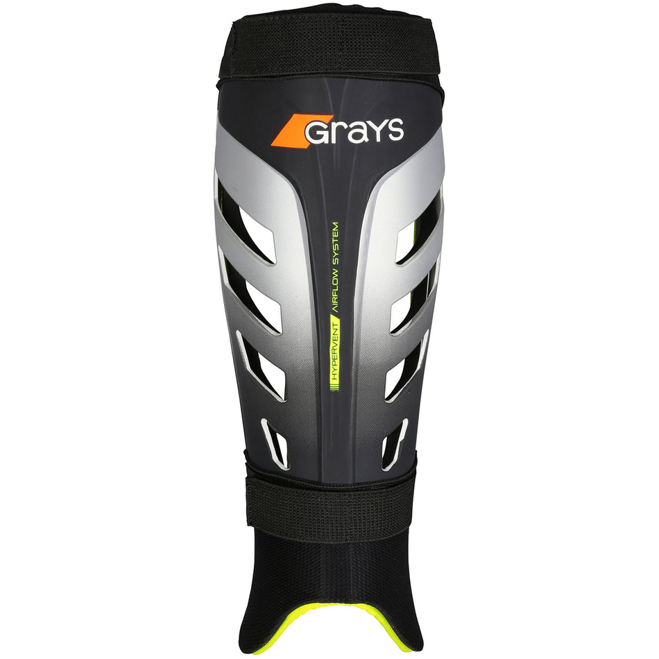 The Grays G800 Shinguard is a premium black, silver, and orange shinguard with a lightweight polymer shell, hypervent ventilation slits, foam padding, and adjustable straps—shown upright to highlight its protective front by Grays.