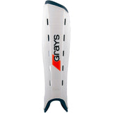 The Grays G600 Hockey Shinguard in White/Navy features a lightweight polymer shell, vertical ventilation slots, and a contoured shape for superior impact protection.